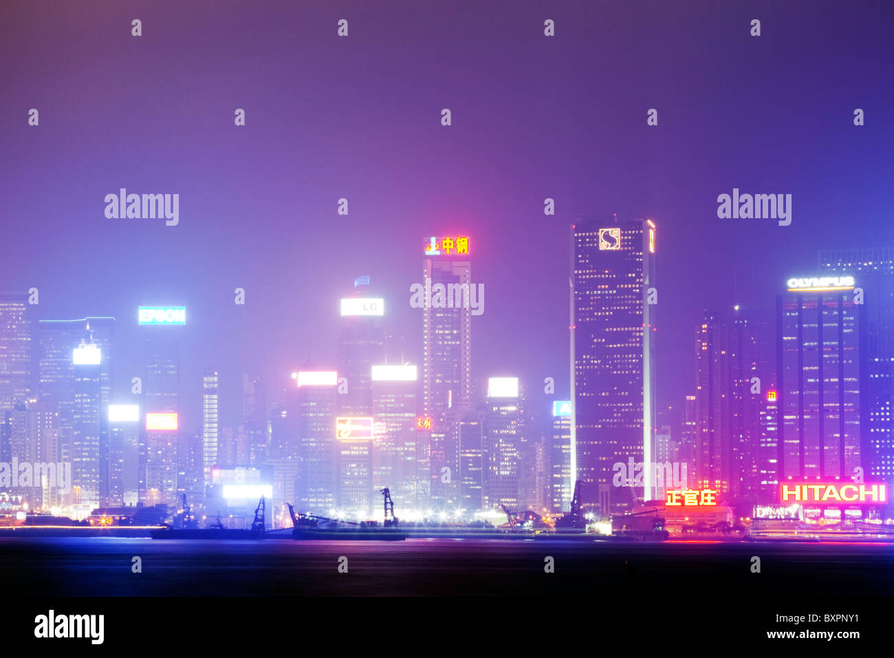 The amazing view of the Hong Kong skyline from the banks of Kowloon at night to show all the lights and buildings at there best Stock Photo