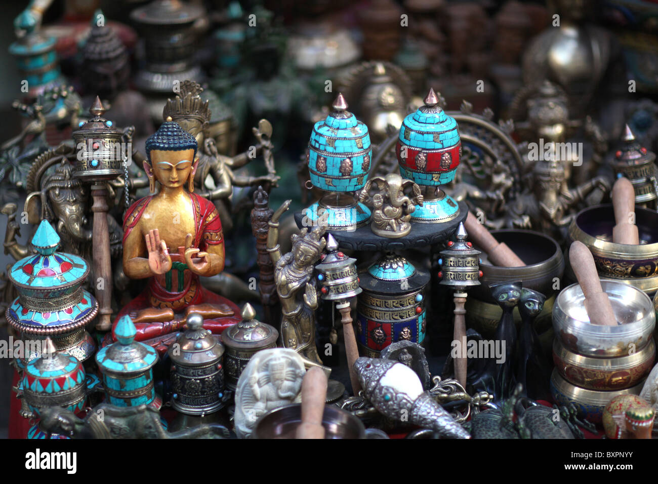 Religious artifacts on display at a shop in Kathmandu, Nepal in Asia Stock Photo