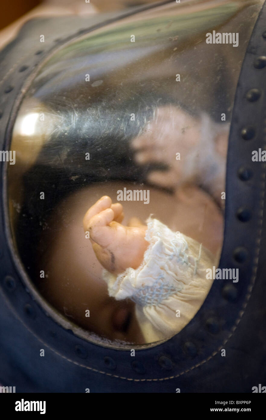 baby doll in baby gas mask Stock Photo - Alamy