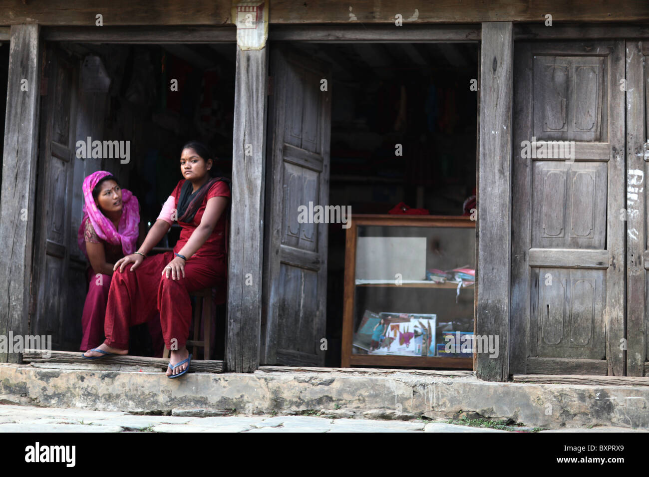 Local women relaxing in the ancient Newari mountain village of Bandipur, Tanahu District, Nepal. Stock Photo