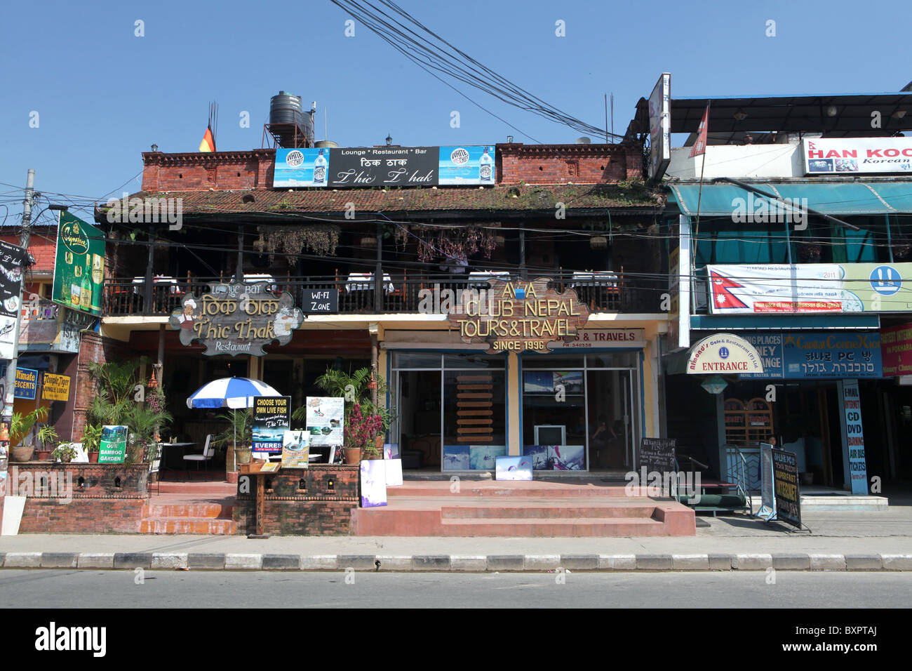 Travel and tour shops in the city of Pokhara in Nepal. Stock Photo