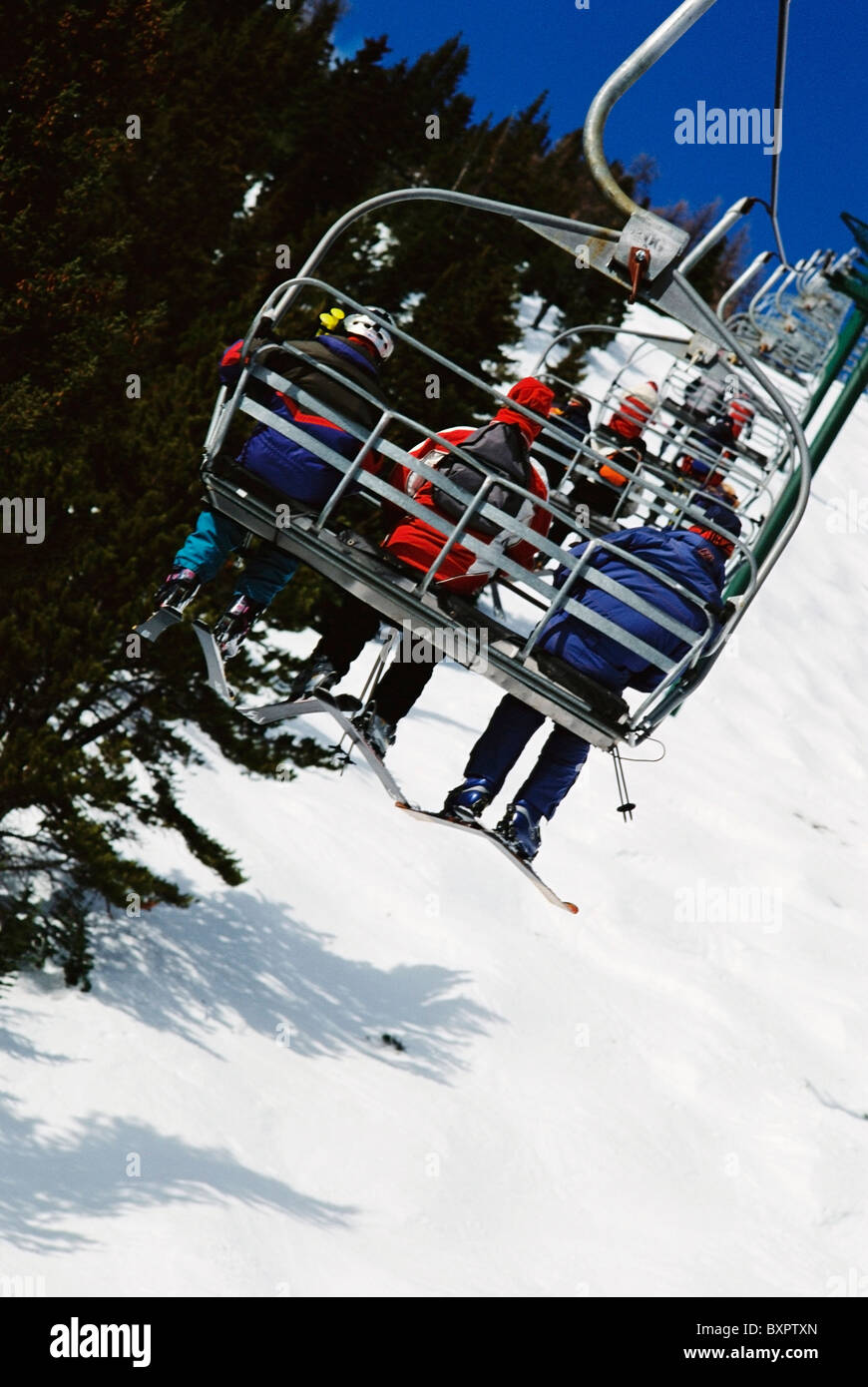 Skiers Going  Up Chairlift, Alberta, Canada Stock Photo