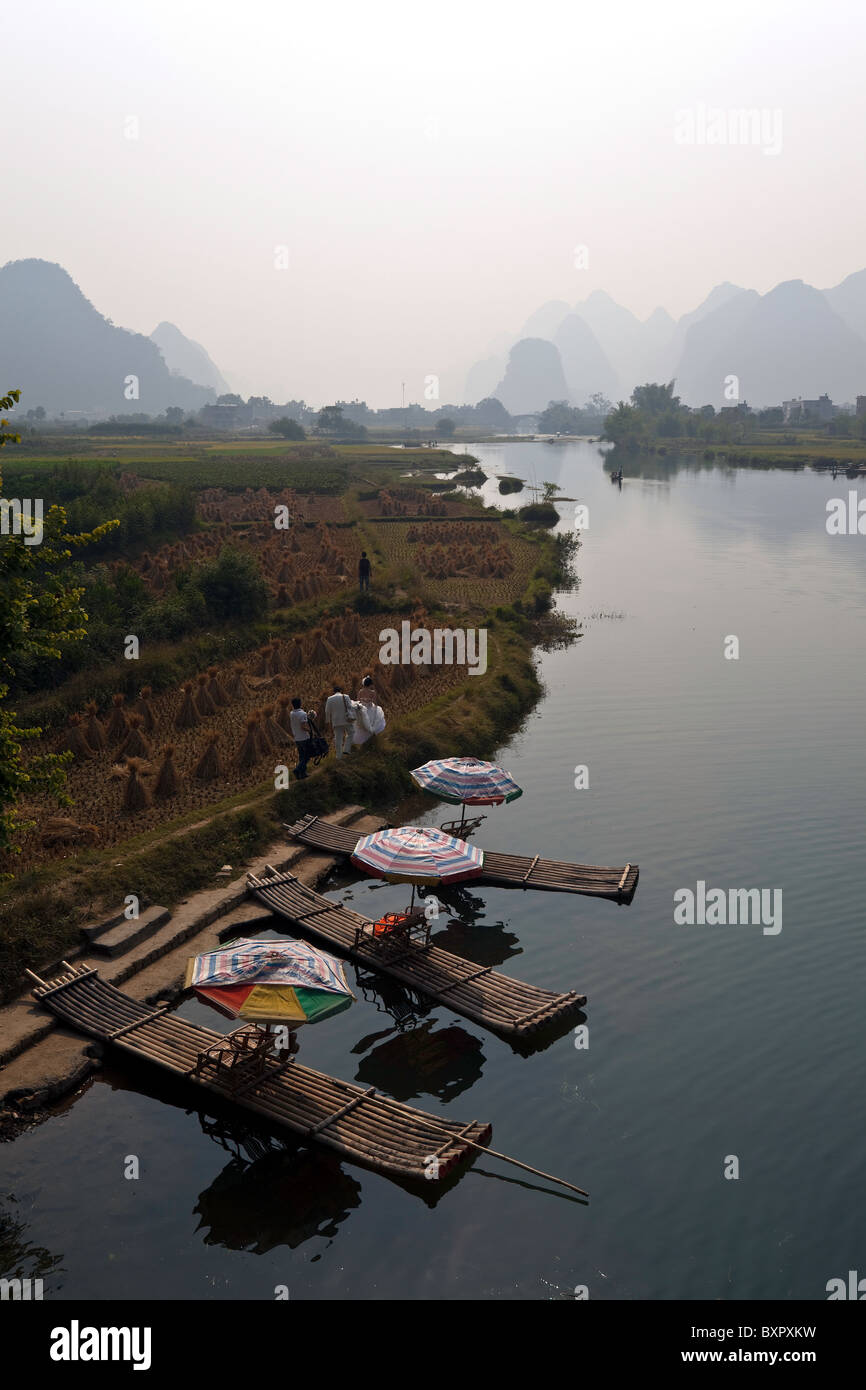 China, Guangxi Province, Yangshuo. Bamboo rafts on the Jade Dragon River. Stock Photo
