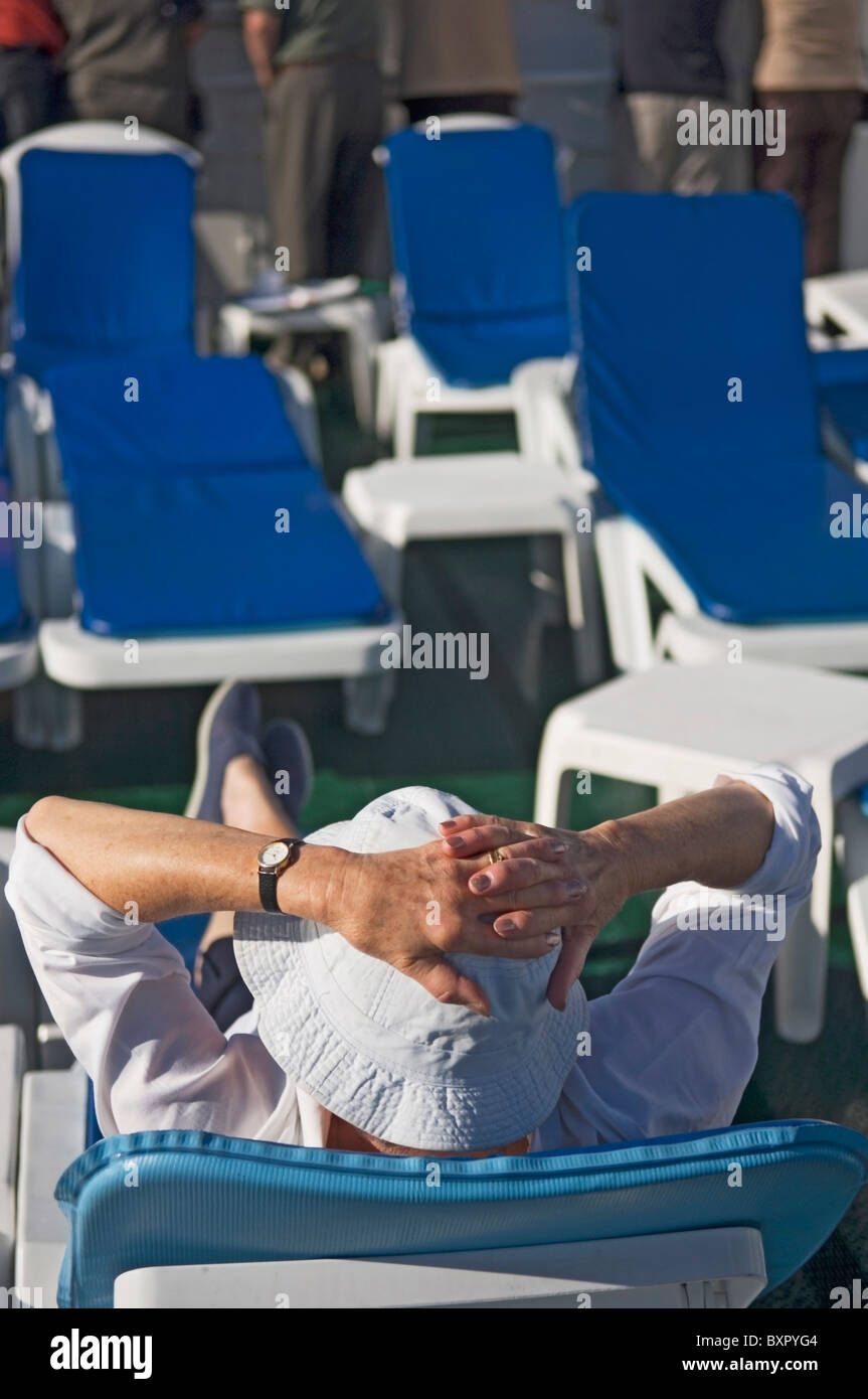 A Passenger Sitting And Relaxing On The Sun Deck Of Cruise Ship Stock ...