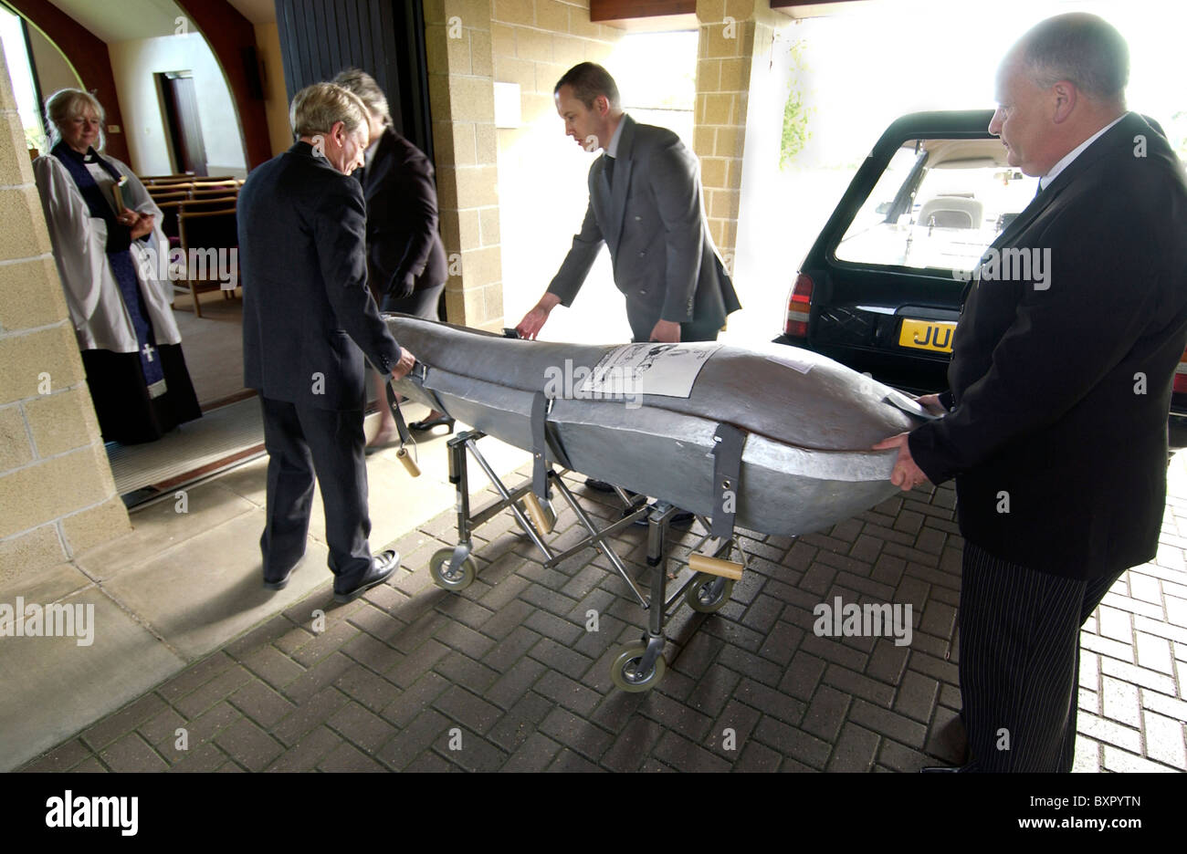 An environmentally friendly Eco-pod coffin being delivered for a natural burial funeral service Stock Photo