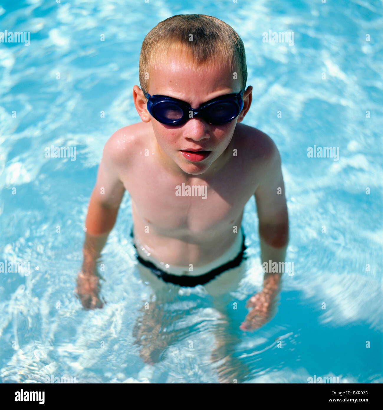 Boy In Swimming Goggles In Swimming Pool Stock Photo Alamy