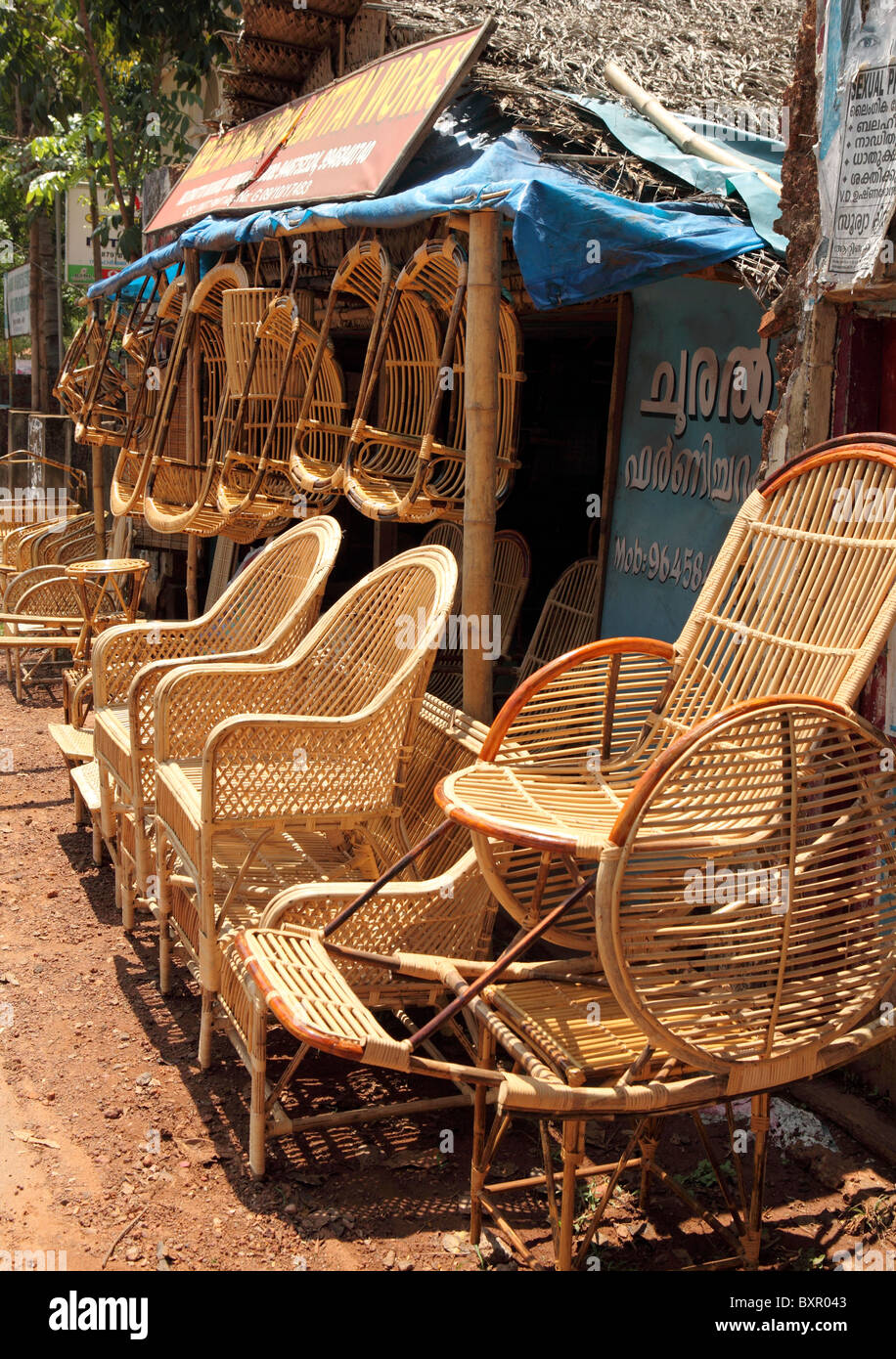 A shop manufacturing traditional indian wicker furniture displays its goods outside its premises in Varkala, Kerala, India Stock Photo