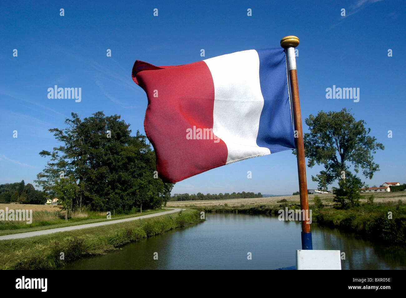 A French Peniche, With French Flag, On Canal Due Centre Stock Photo