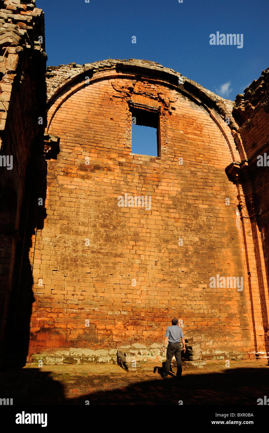 Tourist viewing wall in La Santísima Trinidad de Paraná Mission, Paraguay, South America Stock Photo