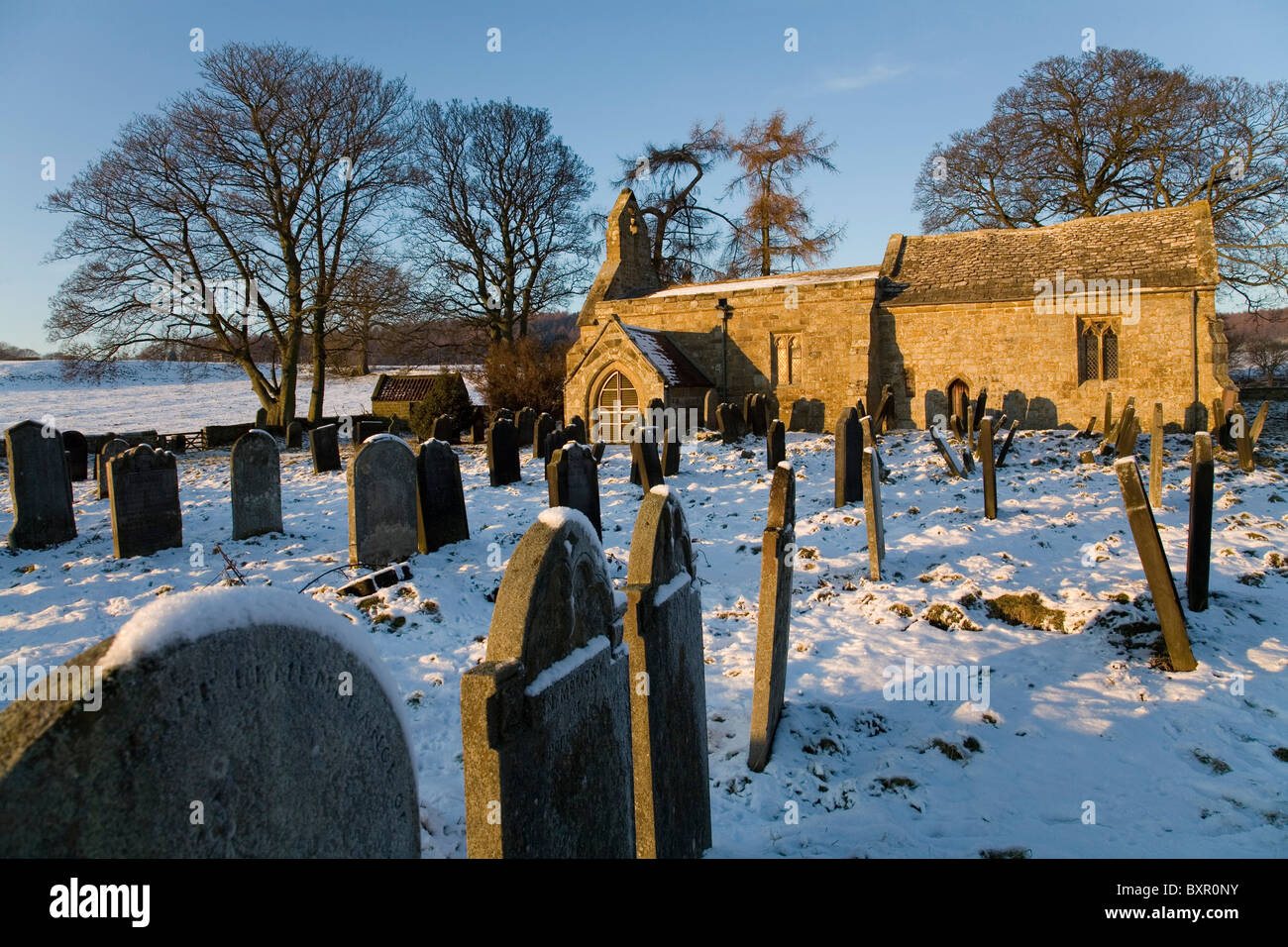 Graveyard of St Mary Magdalene's Church in Winter near Over Silton Village North Yorkshire England Stock Photo