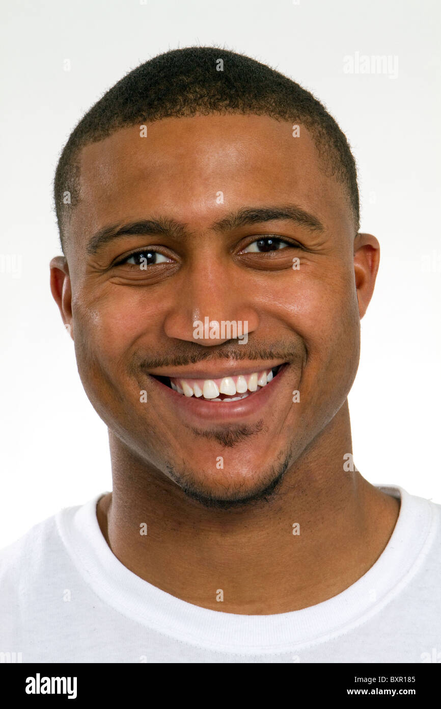 Happy young African American college student with a chipped tooth has a big smile. Stock Photo
