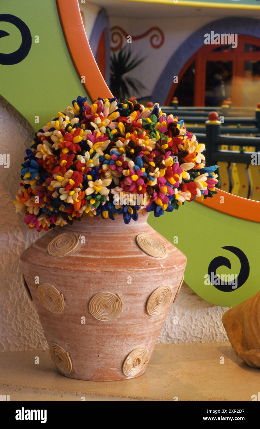 Still Life of Terracotta Vase & Dried Flowers or Paper Flowers in front of Colourful Kitsch Mirror, Coco Beach Hotel, Mauritius Stock Photo