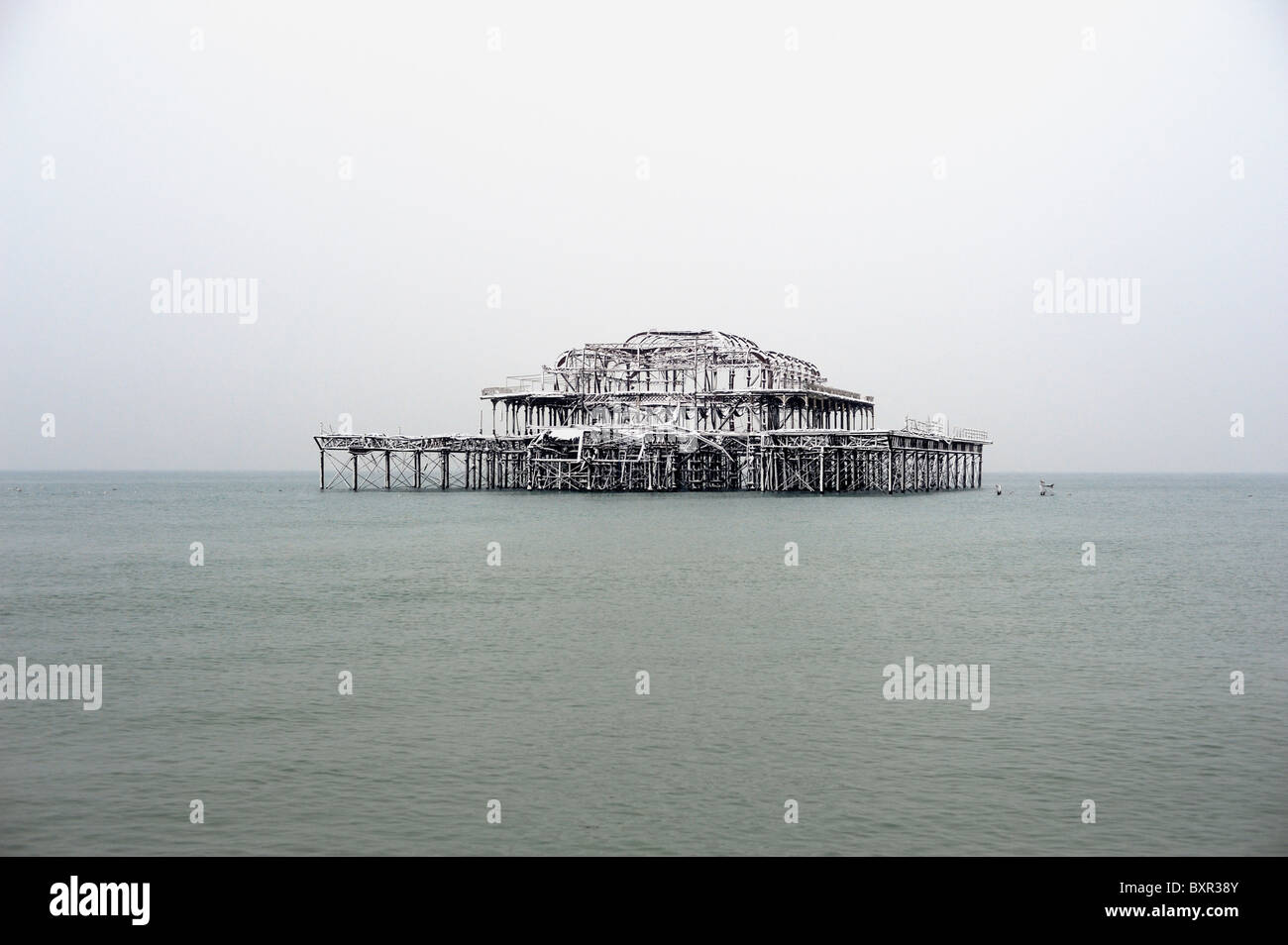 The ruined Brighton West pier covered in snow Stock Photo