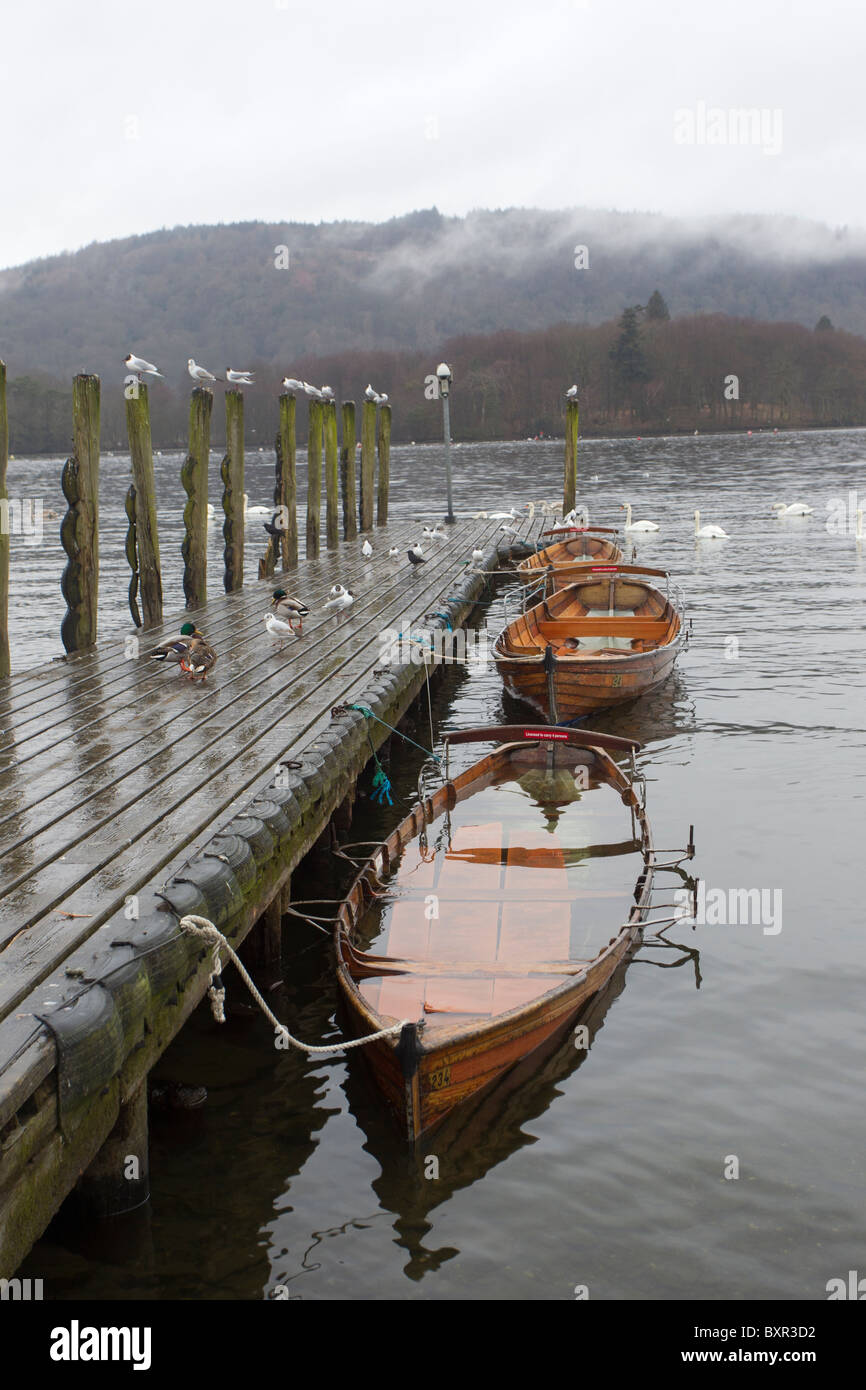 Flooded Rowing Boats on Lake Windermere after heavy rain Stock Photo