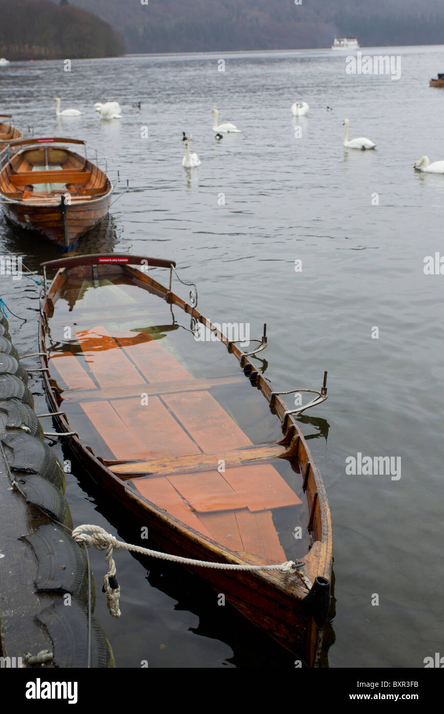 Flooded Rowing Boats on Lake Windermere after heavy rain Stock Photo