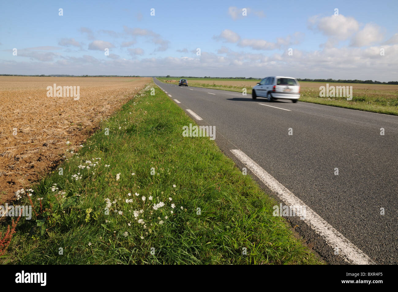 Two cars on open empty department road D332 south of Compiegne France Picardy EMPTY TRAFFIC FREE DEPARTMENT ROAD PICARDY FRANCE Stock Photo