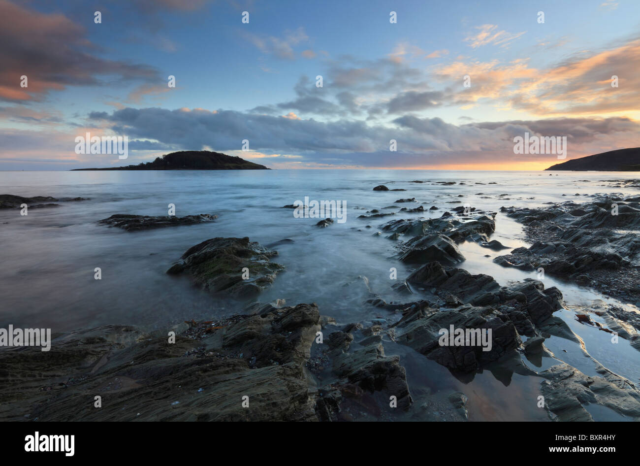 St Georges Island captured from the rocks beneath the sea wall at West Looe, Cornwall Stock Photo