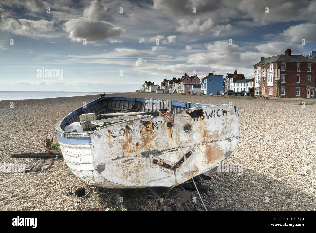 Old fishing boat on the shingle beach at aldeburgh, suffolk uk Stock Photo