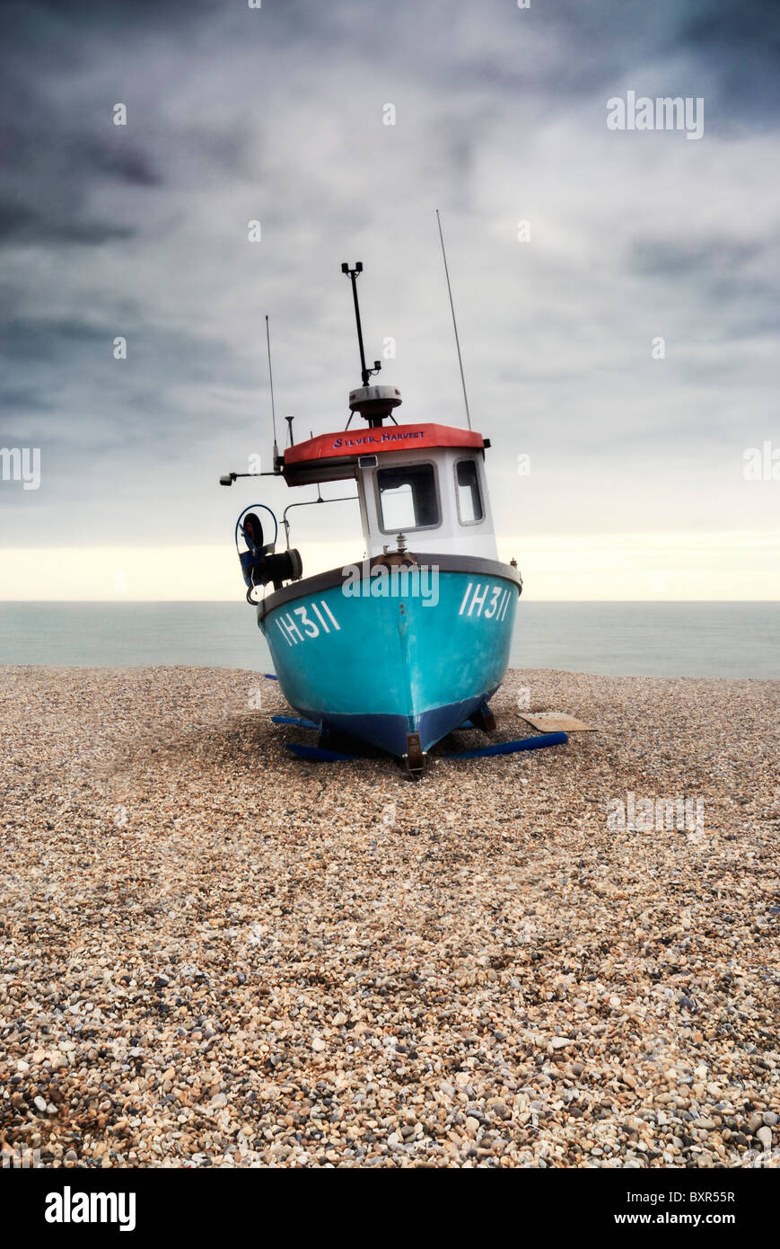Fishing boat on the shingle beach at Aldeburgh, Suffolk Stock Photo