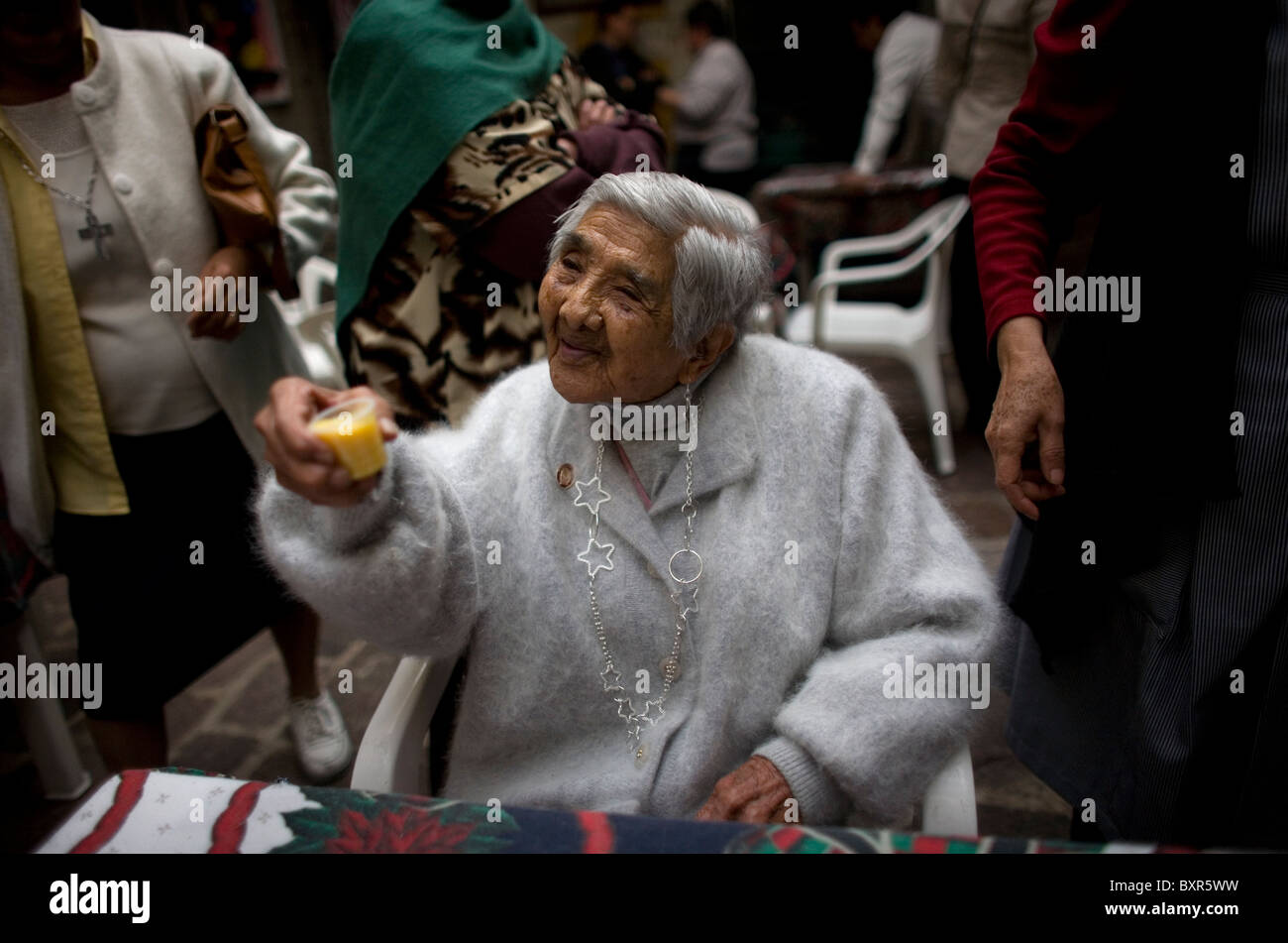 Isabel Alarcon, 100, toasts during the celebration of her one hundred year's old birthday in Mexico City Stock Photo
