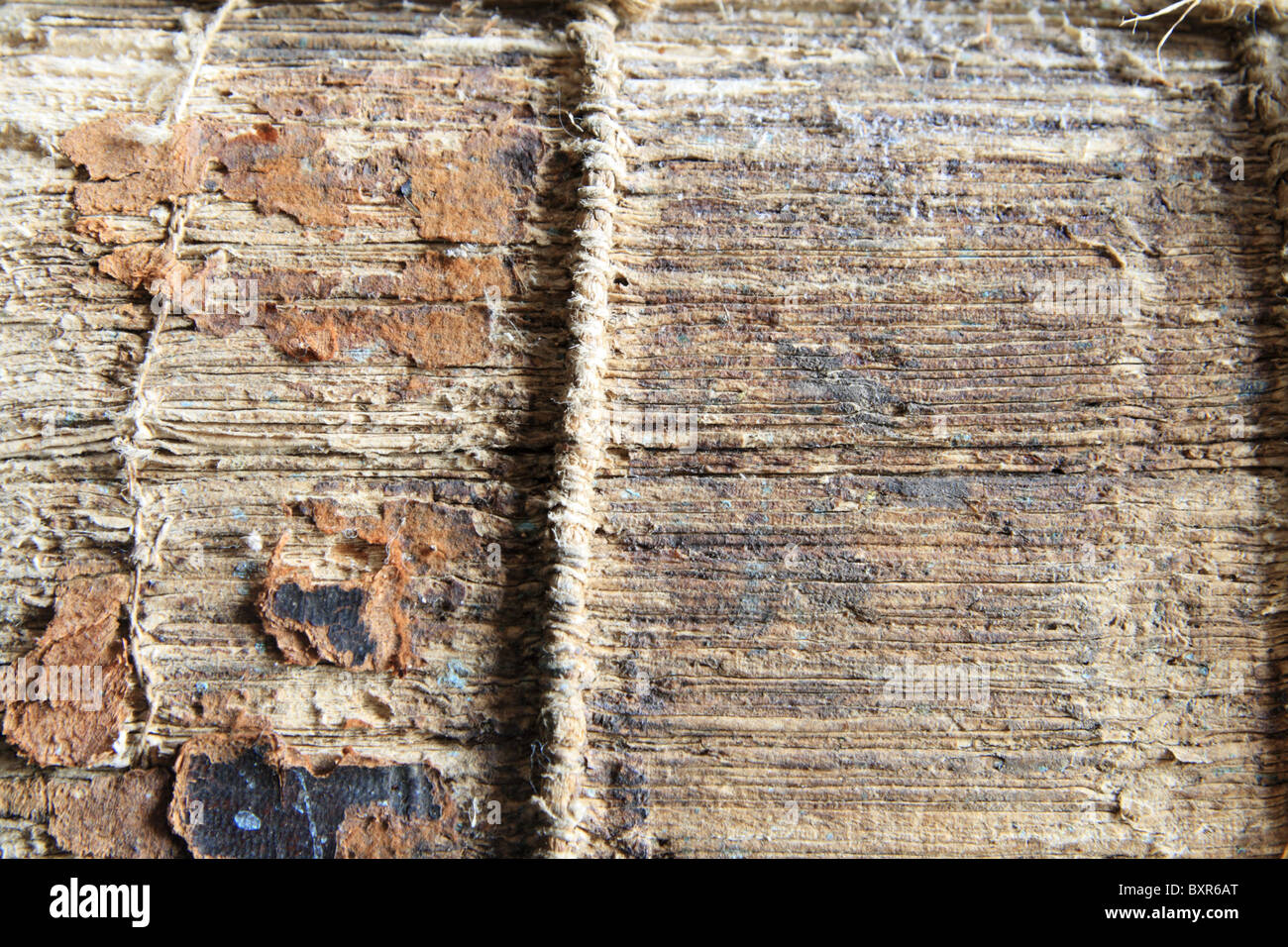 the binding spine of an old and damaged book Stock Photo