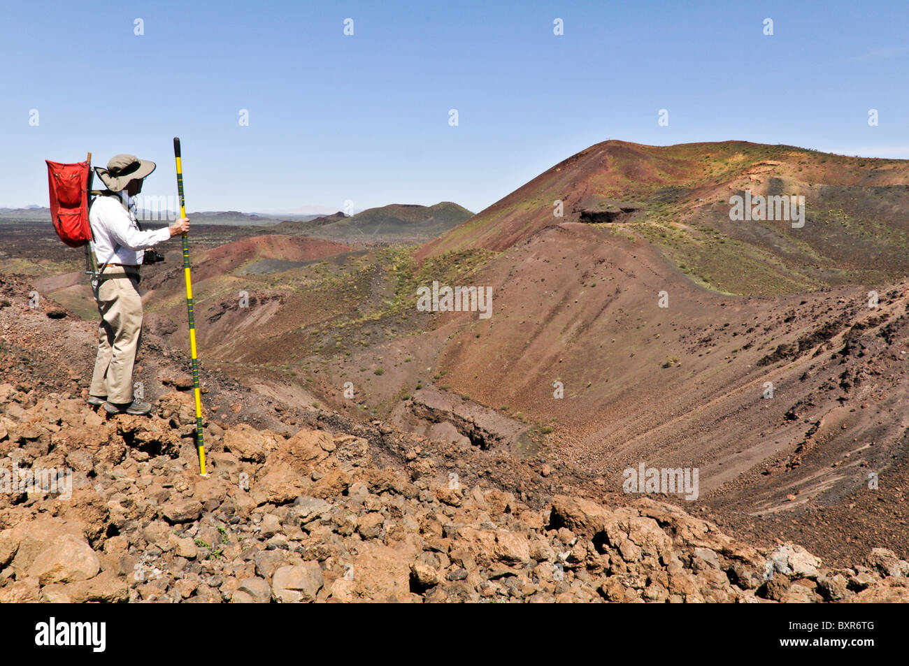 Geologist viewing interior of Tecolote cinder cone, El Pinacate Biosphere Reserve, Sonora, Mexico Stock Photo