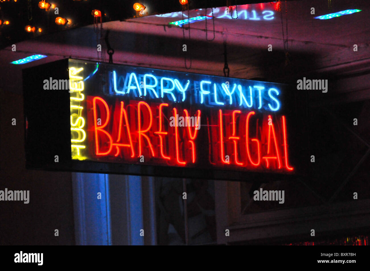 Hustler Larry Flynts Barely Legal' neon sign on Bourbon Street, French Quarter, New Orleans, Louisiana Stock Photo