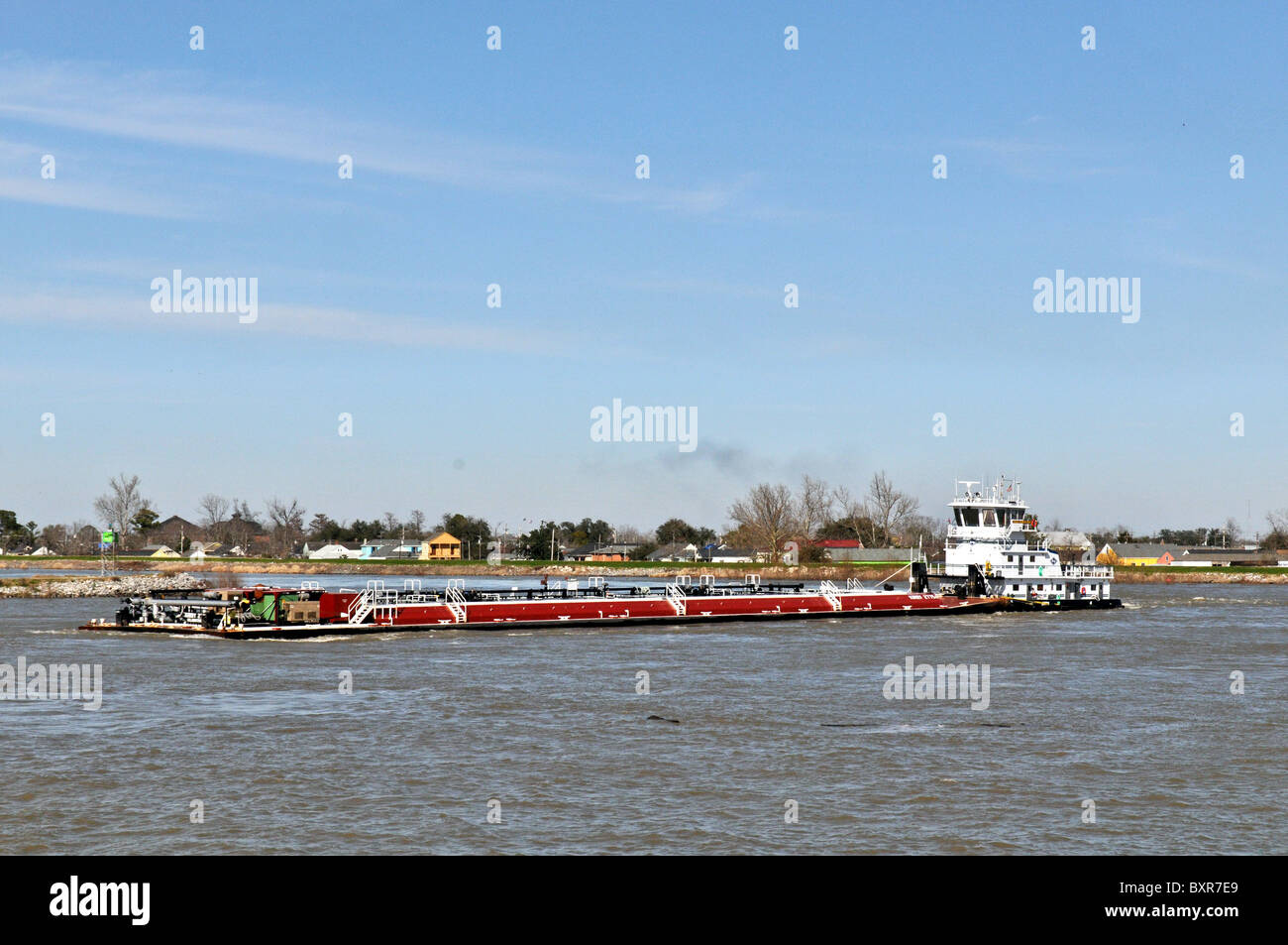 Tugboat pushing oil barge, Mississippi River, New Orleans, Louisiana Stock Photo