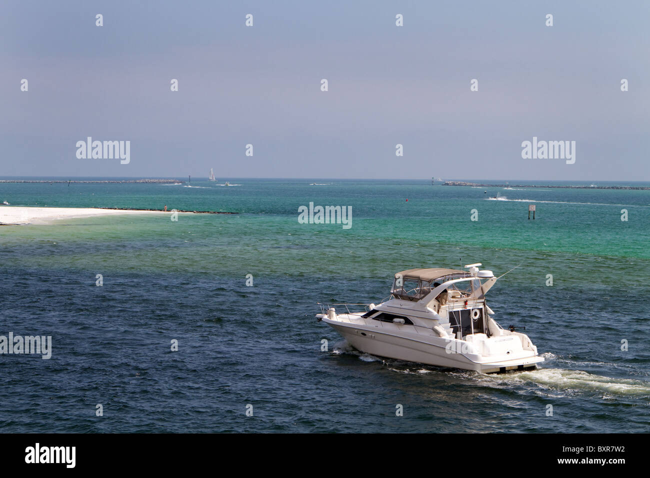 Cabin Cruiser Motors Through The Waters Of Destin Pass Florida