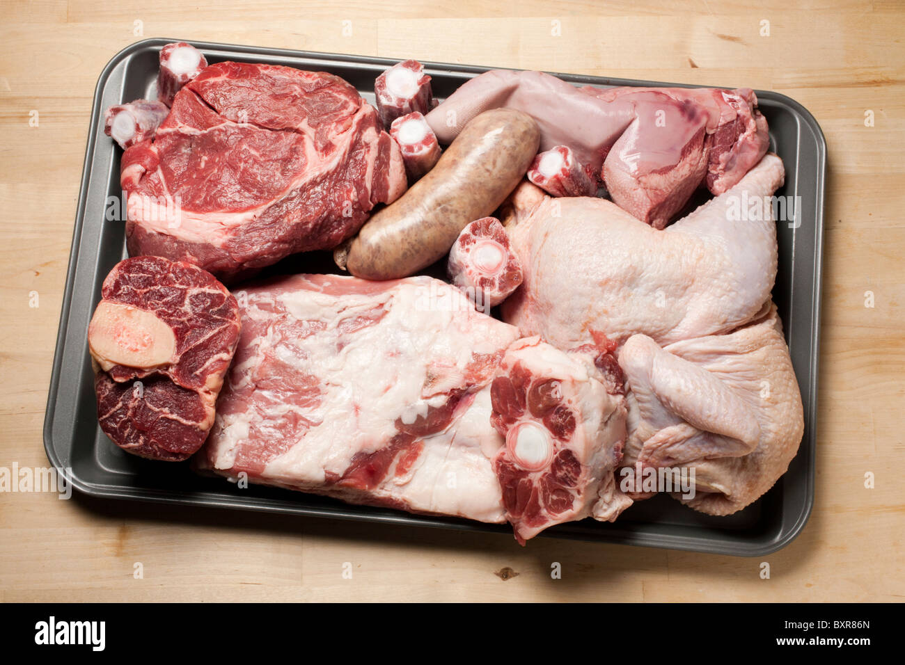 Raw ingredients for bolito misto, the classic Northern Italian meat stew Stock Photo