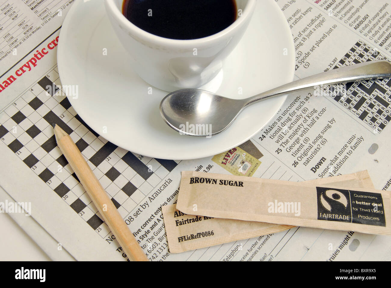 Crossword puzzle coffee break cryptic clues Stock Photo Alamy