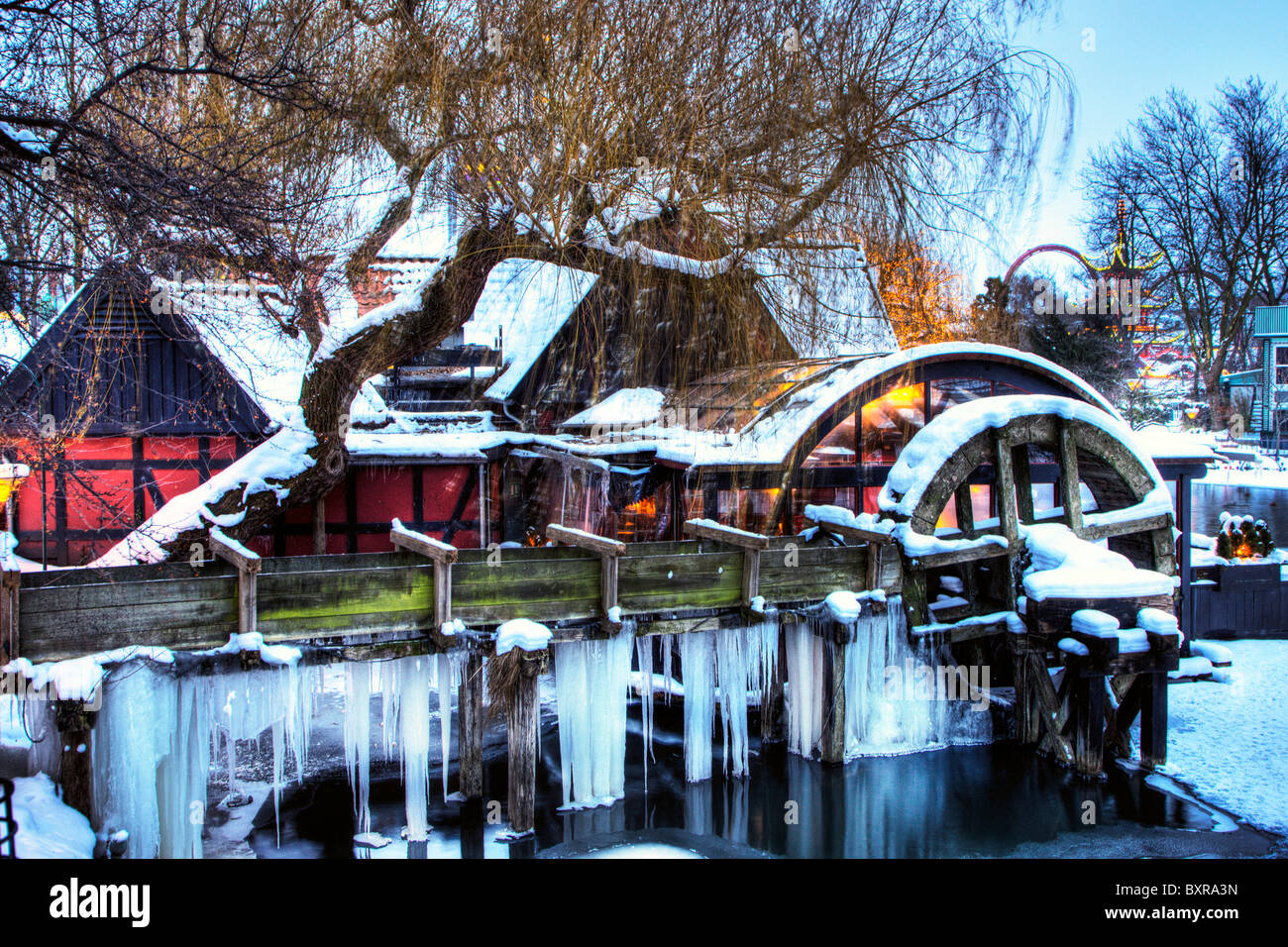 The old water mill in Tivoli Copenhagen covered in ice Stock Photo