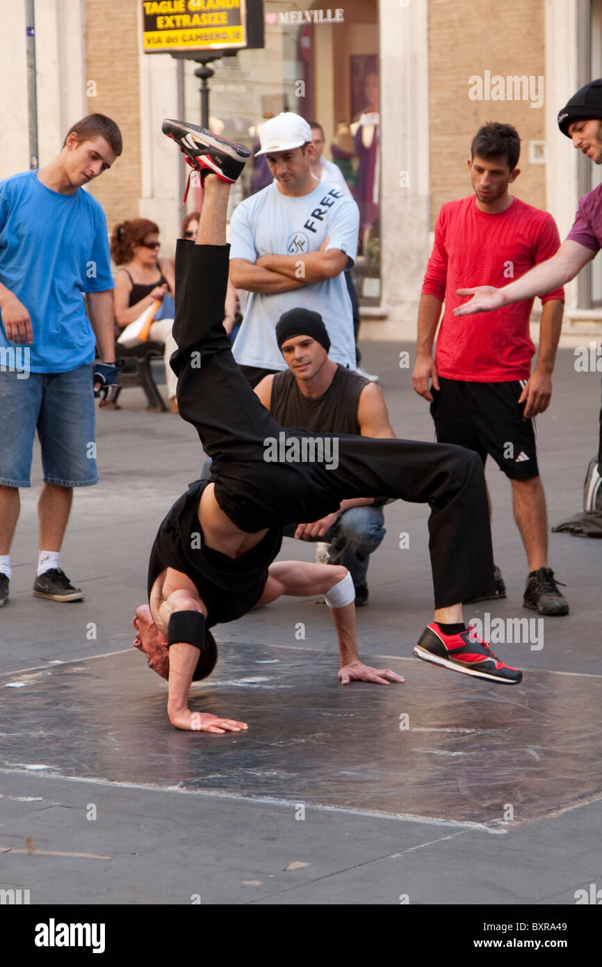 Streetdancer/Breakdancer in front of Basilica dei Santi Ambrogio e Carlo al Corso, Rome, Italy Stock Photo