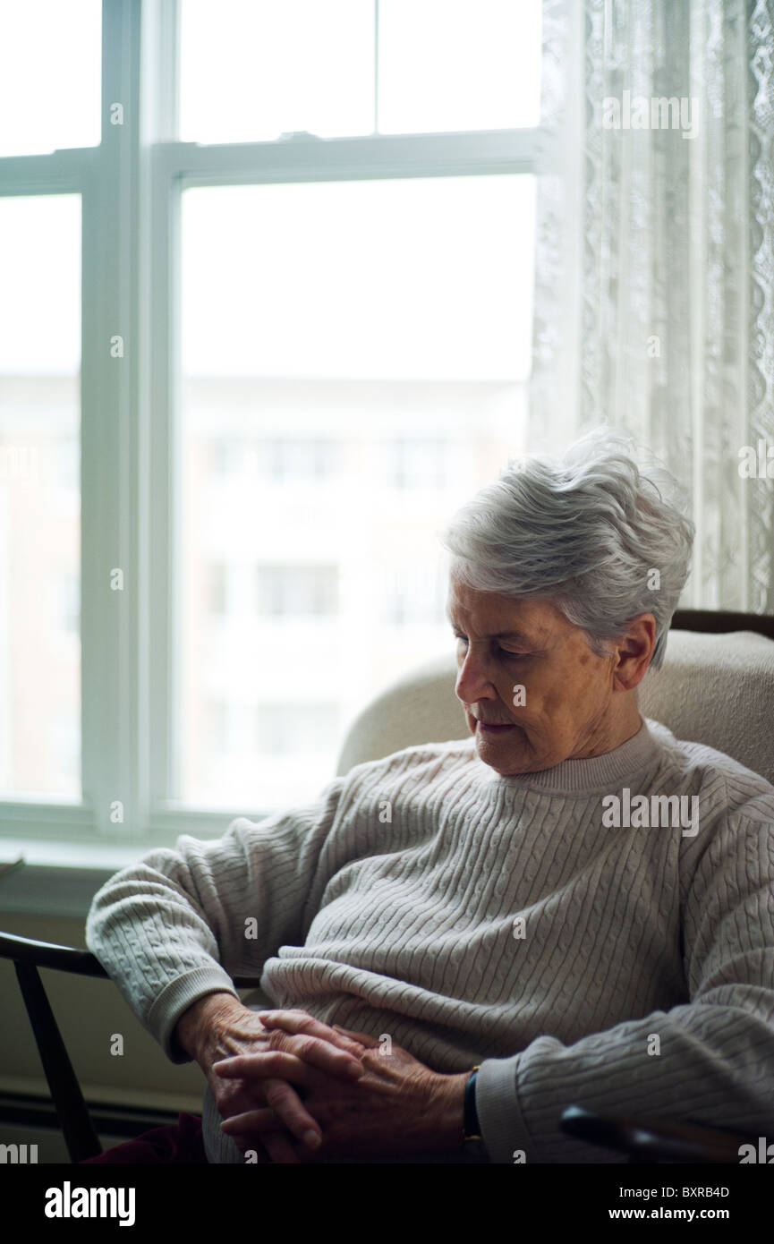 Old woman alone chair sad hi-res stock photography and images - Alamy