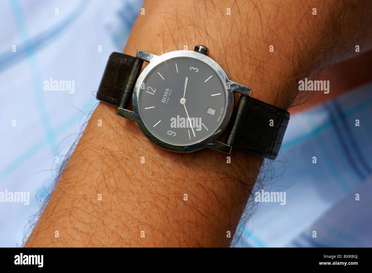 Man wearing Hugo Boss watch Stock Photo - Alamy