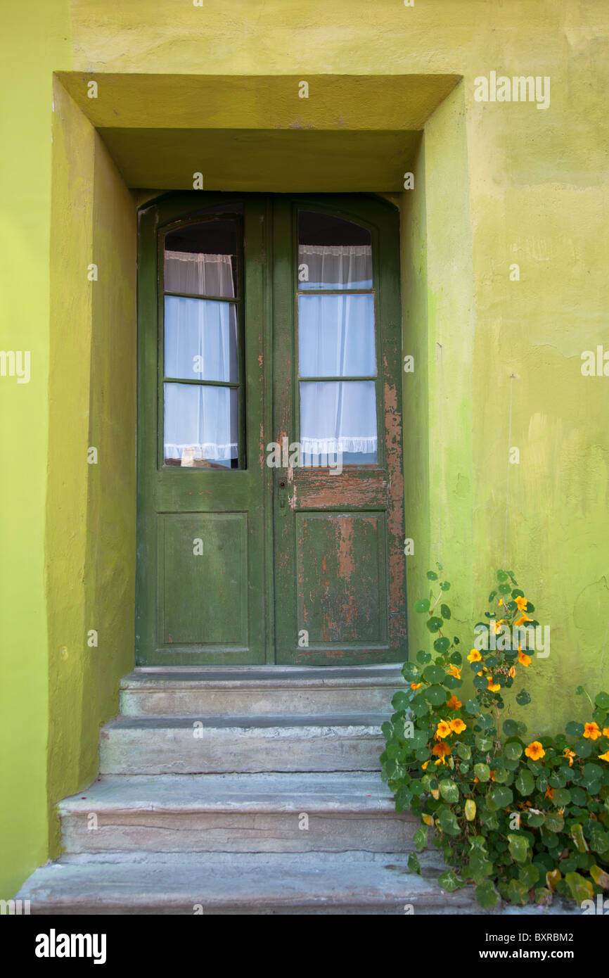 Front view of a medieval house with green door and green wall in Sighisoara, Romania. Stock Photo