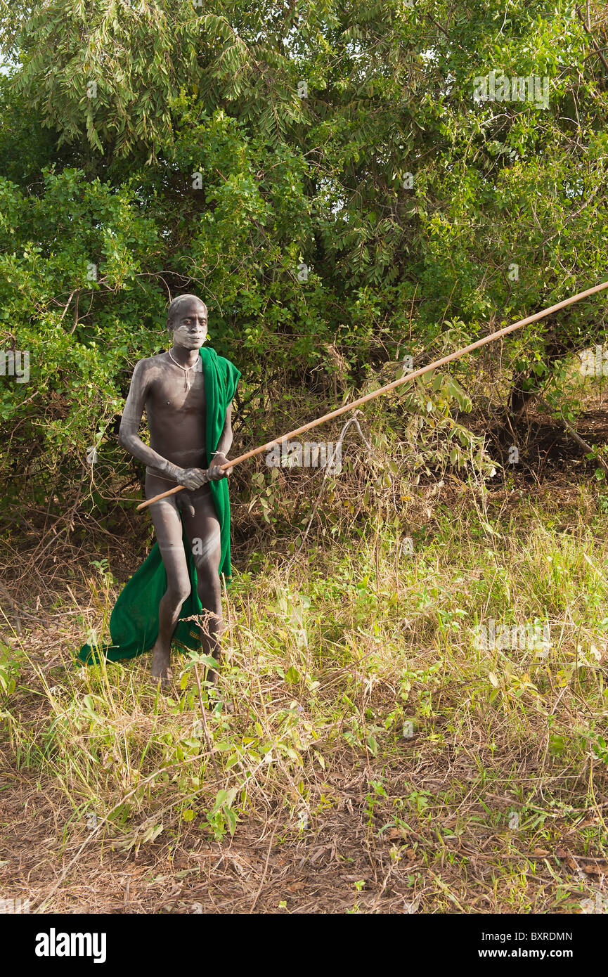 Exercising Surma Donga fighter, Tulgit, Omo River Valley, Ethiopia Africa Stock Photo