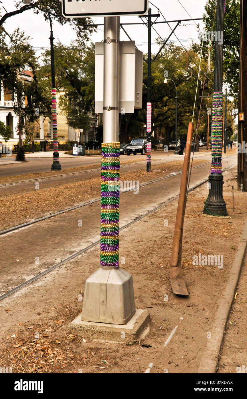 Poles decorated with Mardi Gras beads, St. Charles St. parade route, New Orleans, Louisiana Stock Photo