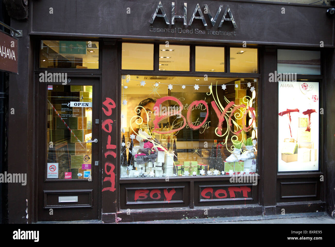 Entrance to the Ahava store which has been daubed in graffiti to boycott the store  Monmouth Street Covent Garden London Stock Photo