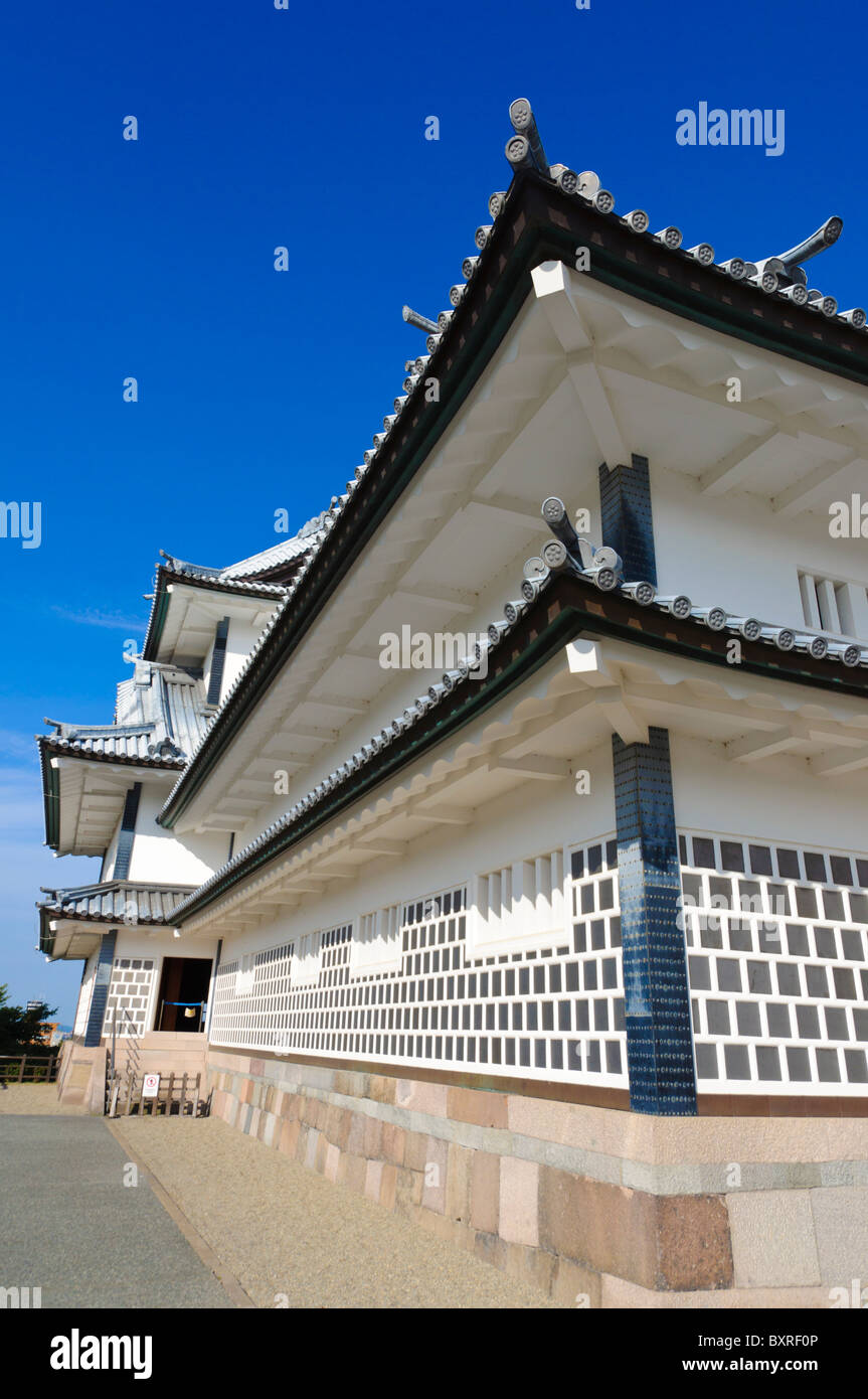 Roof corner and white walls of Kanazawa castle, Japan. This is typical of Japanese castles. Stock Photo