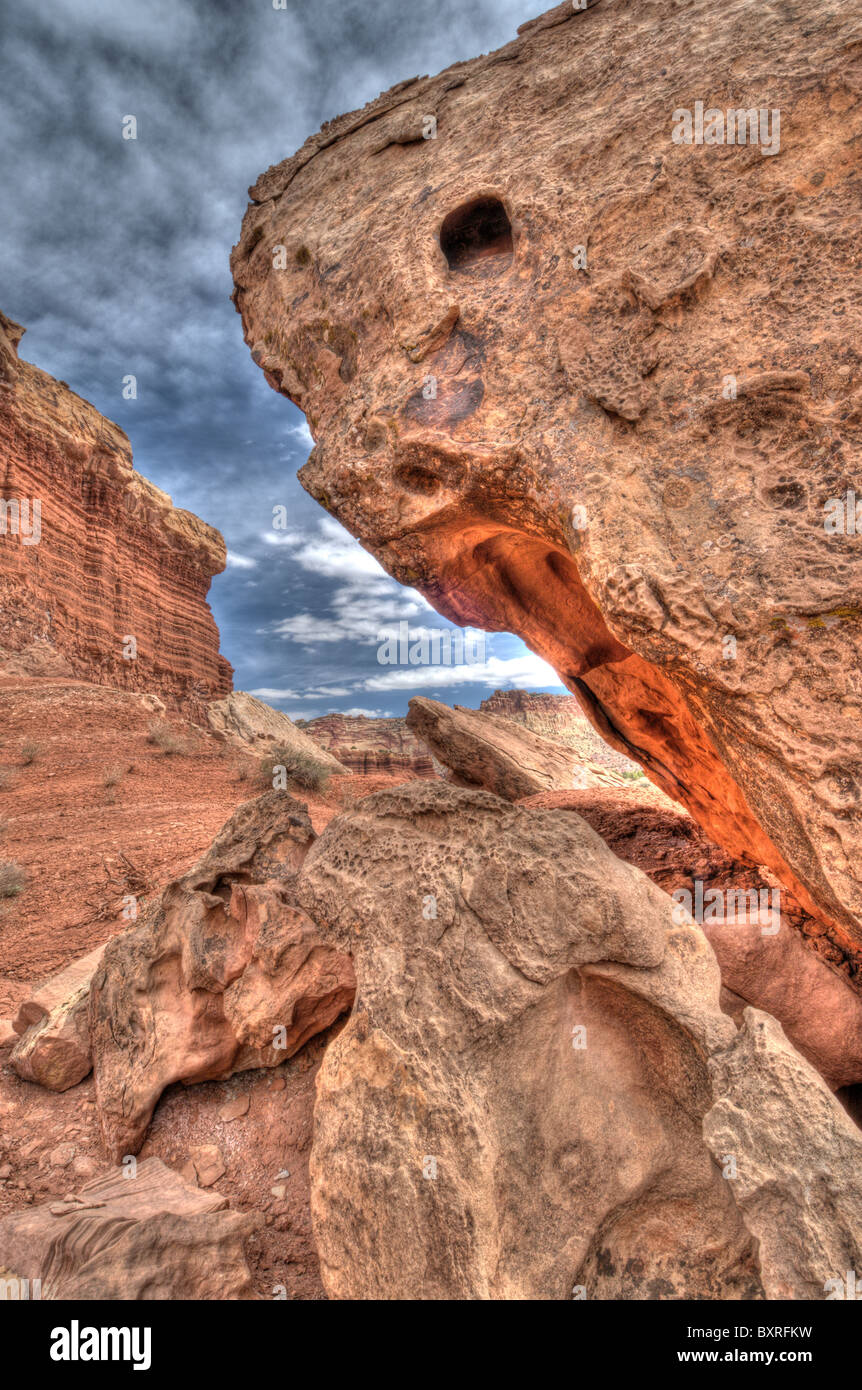 Surreal HDR image of rock formations beneath the cliffs of Capitol Reef Stock Photo
