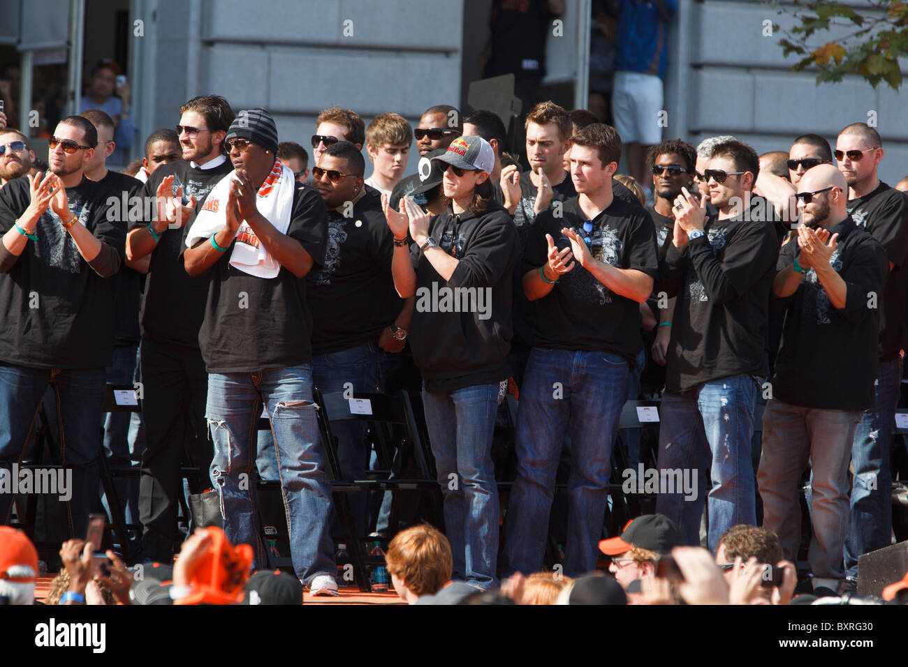 The San Francisco Giants applaud owner representative William Neukom during the World Series victory parade at City Hall Stock Photo