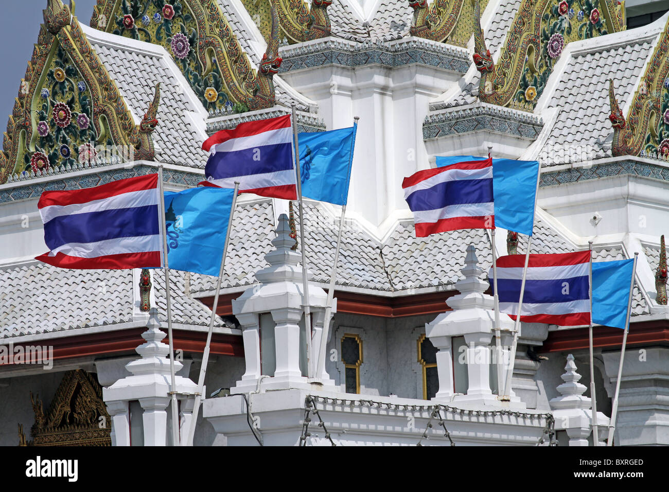 Bangkok City Pillar Shrine, Lak Muang, with Thai flags in Bangkok, Thailand Stock Photo