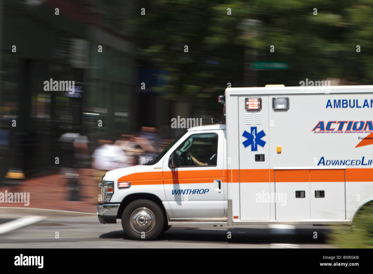 ambulance racing down Boston, MA city streets to an emergency Stock