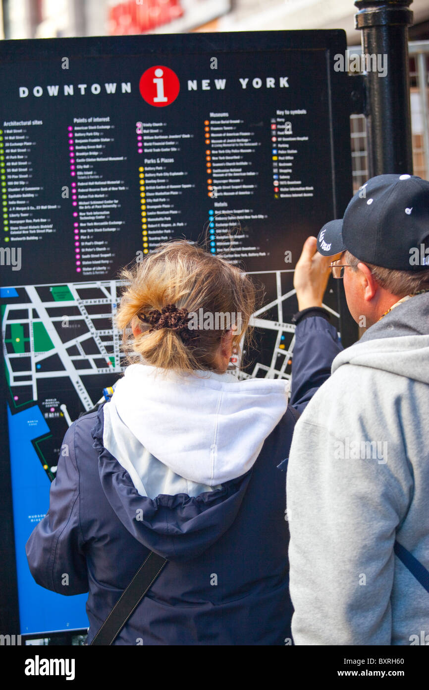 Tourists finding their way in downtown Manhattan, New York City Stock Photo