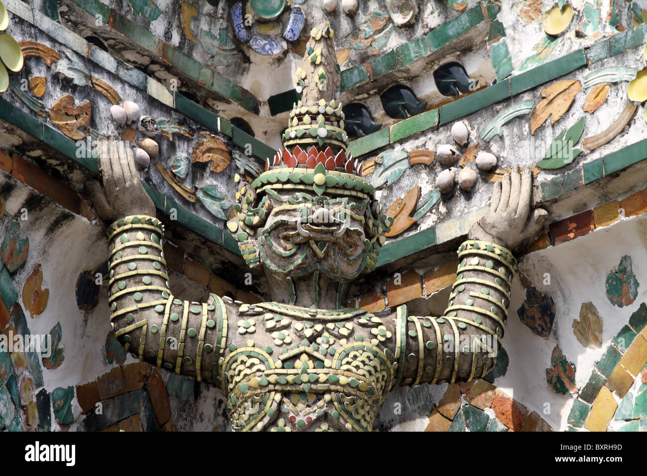 Statue on a Chinese porcelain prang at Wat Arun, Temple of the Dawn in Bangkok, Thailand Stock Photo