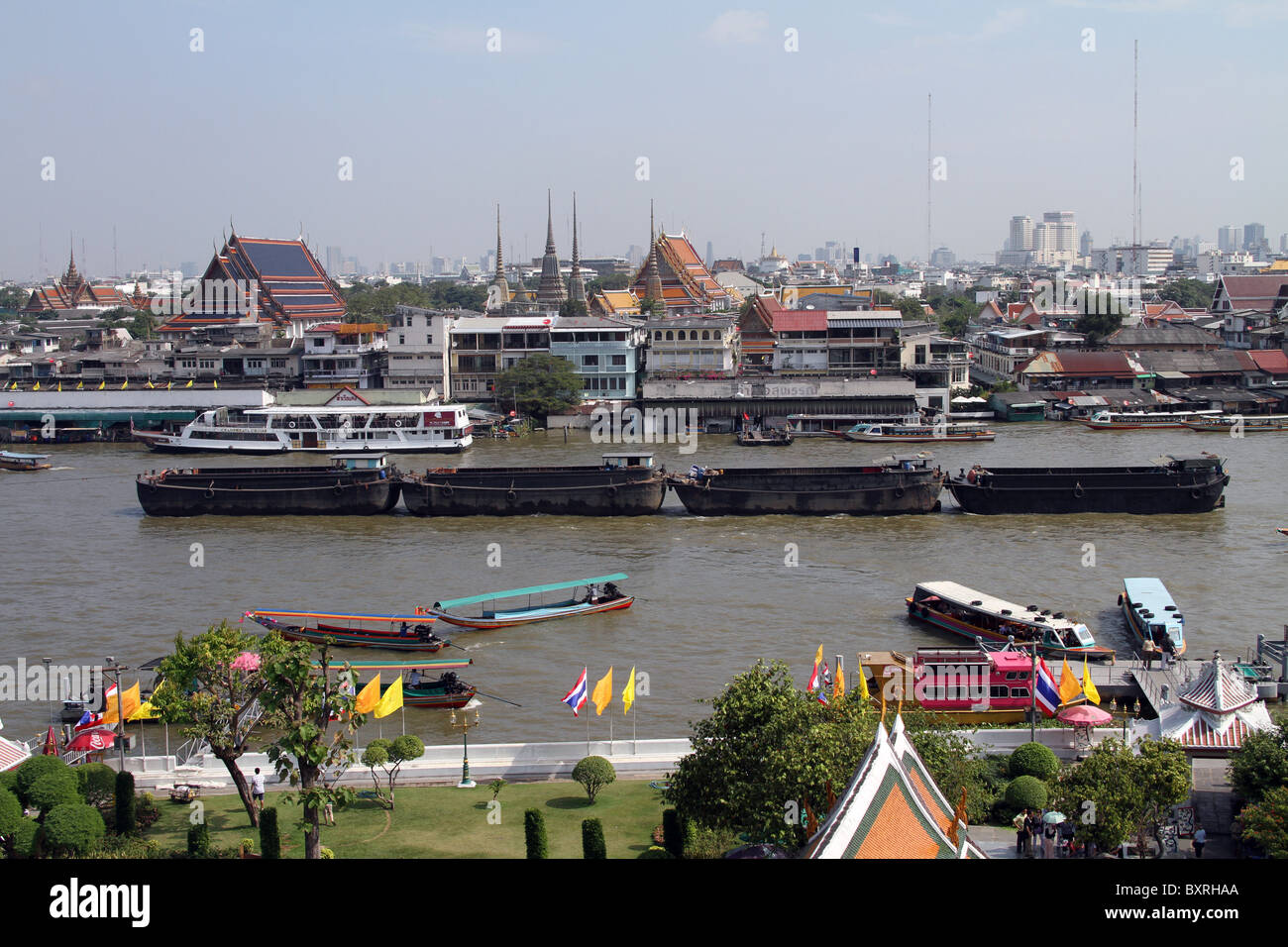 Boats and river traffic on the Chao Phraya River in Bangkok, Thailand ...