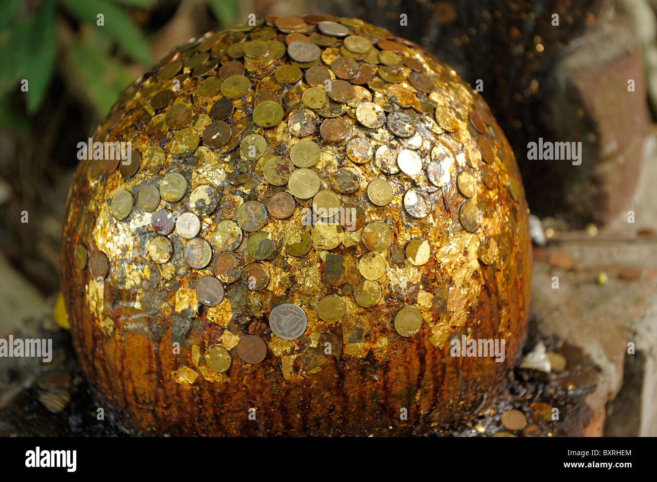 money stuck on good luck ball , Wat Bang Kung  in Amphawa district, Samut Songkhram , thailand Stock Photo