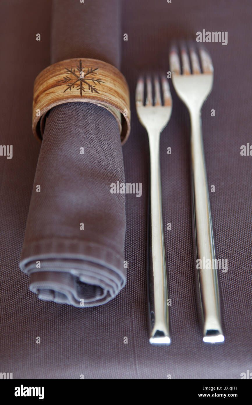 napkin and forks laid out at restaurant Le Cristal at lift station Les Ruinettes in the Alps above Verbier, Switzerland Stock Photo