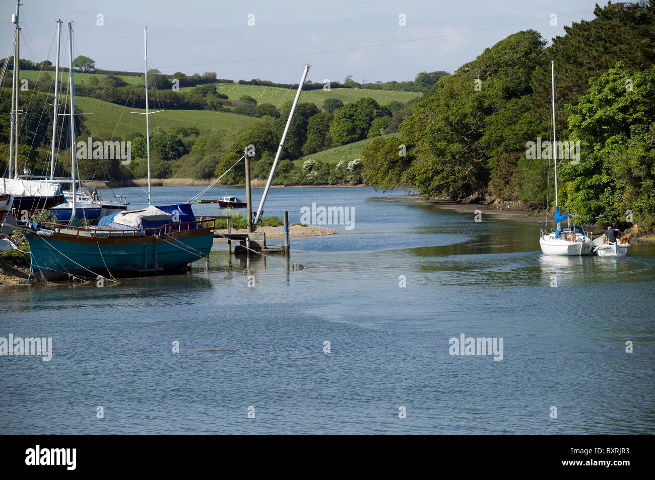 Great Britain, England, Cornwall, Roseland Peninsula, boats moored on the banks of one of the creeks of the River Fal Stock Photo